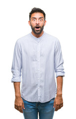 Fototapeta premium Adult hispanic man over isolated background afraid and shocked with surprise expression, fear and excited face.