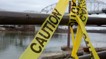 Caution tape at crime scene along river 4k
- Powered by Adobe