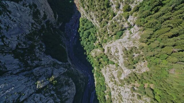 downward aerial of Bicaz-Chei mountain river valley, Bicaz Gorge, running mountain stream where tourists stop to take in the breathtaking views in Romania