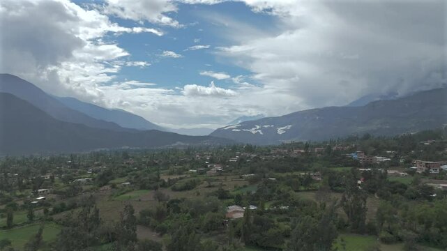 Aerial view of the town of Caraz  with mountains background.