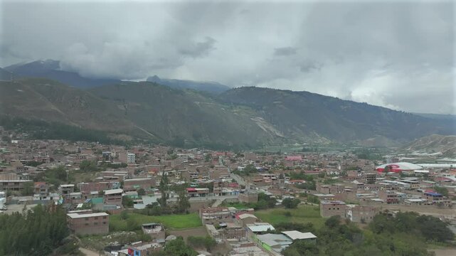 Aerial view of the town of Caraz  with mountains background.