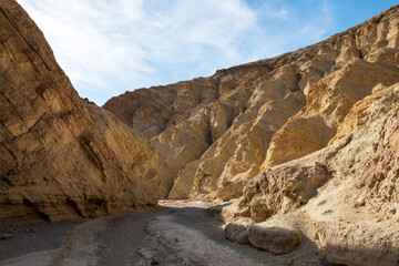 A rocky canyon with a clear blue sky above