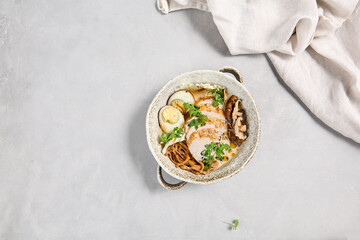 Delicious Chicken Ramen with Marinated Egg and Fresh Garnish – Top View