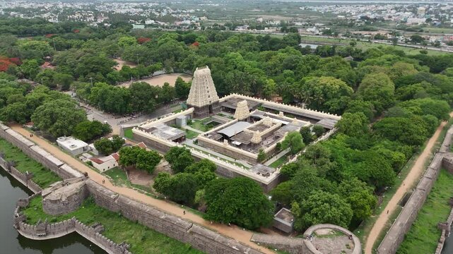 Aerial Shot of Vellore Temple surrounded by Thick Forest near a pond