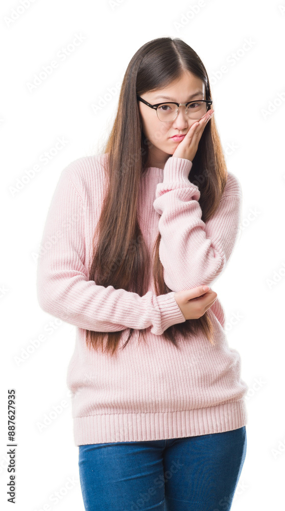 Sticker Young Chinese woman over isolated background wearing glasses thinking looking tired and bored with depression problems with crossed arms.