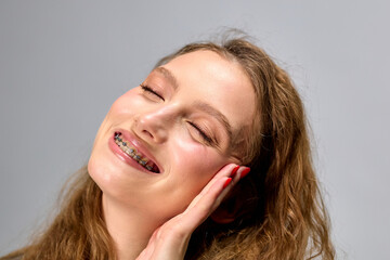Happy Woman Smiling.Braces on teeth