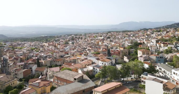 Aerial Cityscape Shot Of Homes And Streets In Dorgali, Sardina. Italian Travel Destination.
