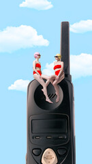 Contemporary art collage. Two friends in red swimsuits sit atop vintage phone, enjoying sunny sky,...