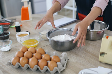 Woman Hands Preparing Ingredients For Making Cake