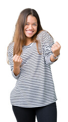 Young beautiful brunette woman wearing stripes sweater over isolated background very happy and...