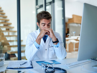 Hospital, computer and doctor with headache, stress and worry for medical service, job and career....