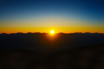 Glowing Orange Sunrise over Mountain...