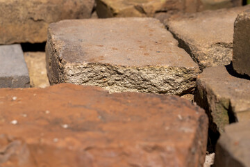 old used bricks made of red clay and other materials