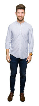 Young handsome man winking looking at the camera with sexy expression, cheerful and happy face.