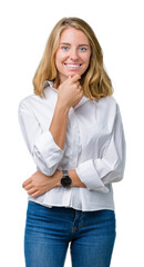 Beautiful young business woman over isolated background looking confident at the camera with smile with crossed arms and hand raised on chin. Thinking positive.