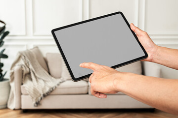 Tablet screen png mockup with sofa background