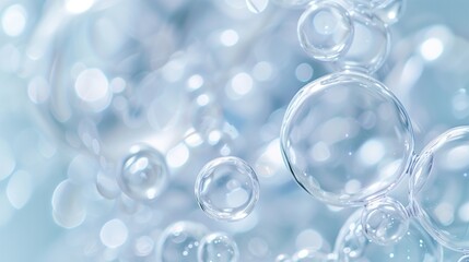 Transparent bubbles on a light blue background.