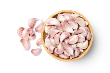 Garlic cloves in wooden bowl isolated on white background, top view, flat lay.