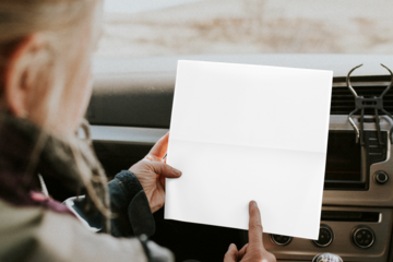Paper map mockup png held by a senior tourist