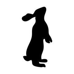 Vector silhouette of a rabbit. Animal fill with one spot. The rabbit stands on its hind legs. Easter bunny. Animal clipart.
