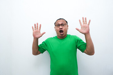 Naklejka premium Wow, Funny face of Asian man. Shocked asian man isolate on white. Amazed and feels shocked asian man. Indonesian man with suprise expression.