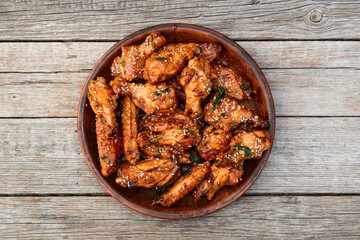 Caramelized in sause chicken wings  . Bar-b-q food background photo