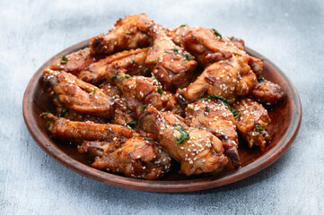 Caramelized in sause chicken wings  . Bar-b-q food background photo
