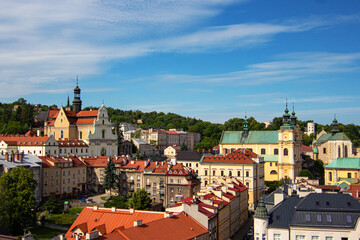 Obraz premium View from Clock Tower of Museum of Bells and Pipes on Baroque Carmelite Church and Monastery, Cathedral of St. John the Baptist, Cathedral Basilica of Przemysl and Przemyśl Castle in Przemysl, Poland