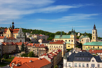 Fototapeta premium View from Clock Tower of Museum of Bells and Pipes on Baroque Carmelite Church and Monastery, Cathedral of St. John the Baptist, Cathedral Basilica of Przemysl and Przemyśl Castle in Przemysl city