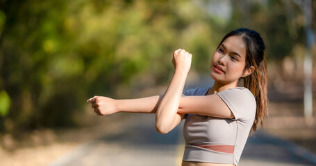 A woman is stretching her arms out in front of her