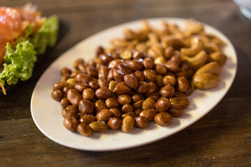 A snack food, peanuts and cashews. Food and beverage lifestyle concept