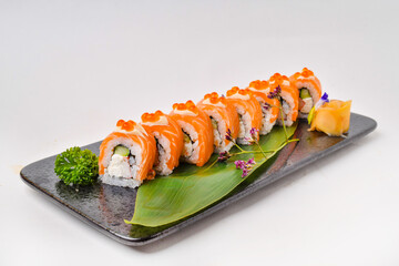 Salmon rolls set in a porcelain dish ready to eat