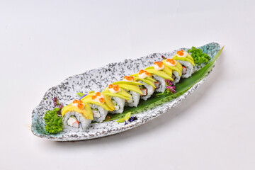 Avocado rolls set in a porcelain dish, ready to eat.