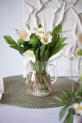Flowers in a vintage vase on the table