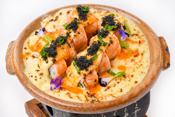Delicious pan-seared salmon and cheese lava rolls topped with caviar.