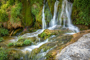 Obraz premium Detail of the Salto de Poveda waterfall on the Tajo River as it passes through the Alto Tajo Natural Park in Guadalajara, Castilla-la Mancha, Spain