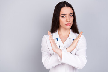 Photo of charming confident woman therapist wear white doctor robe stop sign empty space isolated...