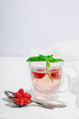 Strawberry tea concept. Good morning concept. Teapot, ripe fruits, healthy beverage