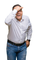 Fototapeta premium Middle age arab elegant man over isolated background very happy and smiling looking far away with hand over head. Searching concept.
