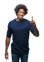 Afro american man over isolated background pointing finger up with successful idea. Exited and happy. Number one.