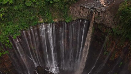 Beautiful droneshot of Tumpak Sewu (Coban Sewu Air Terjun) waterfall in Java, Indonesia