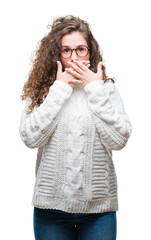 Beautiful brunette curly hair young girl wearing winter sweater over isolated background shocked covering mouth with hands for mistake. Secret concept.