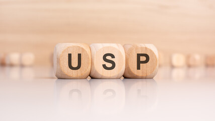 wooden cubes with letters USP. USP - short for Unique Selling Proposition