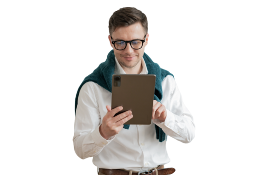 A positive male manager makes use of a tablet and a laptop. cut out
