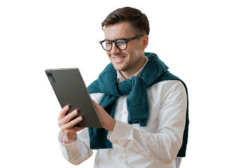A positive male freelancer, a digital nomad, uses a tablet to work. cut out
