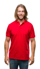 Young handsome man with long hair over isolated background winking looking at the camera with sexy...