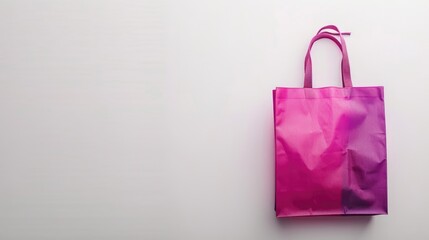 Pink or purple shopping bag on white background with space for text or product