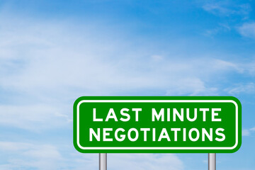 Green color transportation sign with word last minute negotiations on blue sky with white cloud background
