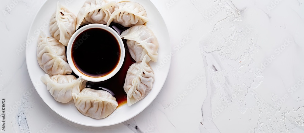 Leinwandbilder a white background with steamed dumplings and soy sauce providing room for text or other elements in