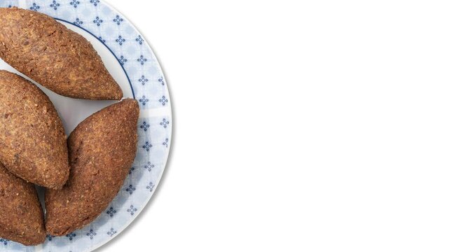 Traditional arabic fried kibbeh isolated over white background with copy space